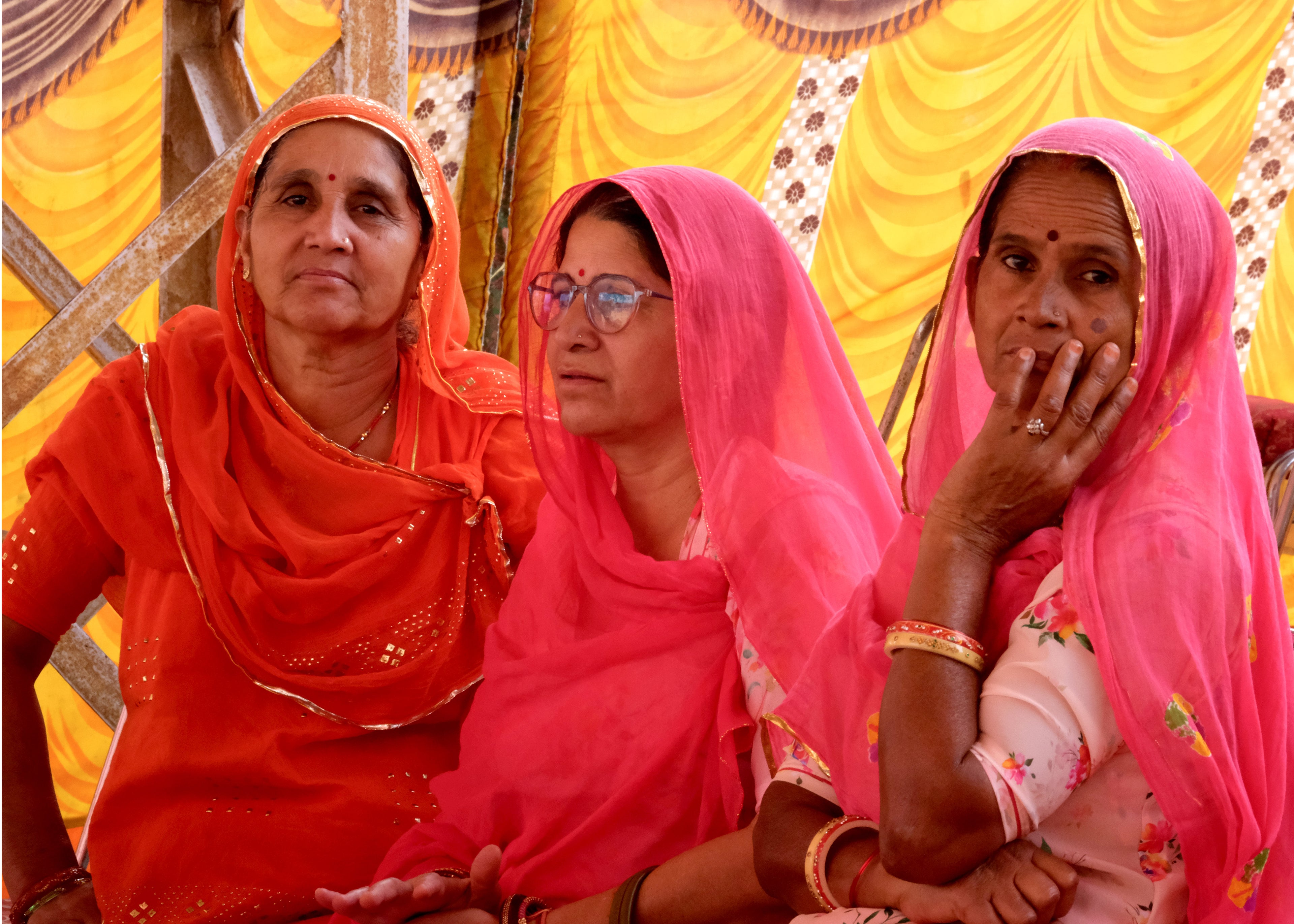 3 Village ladies sitting